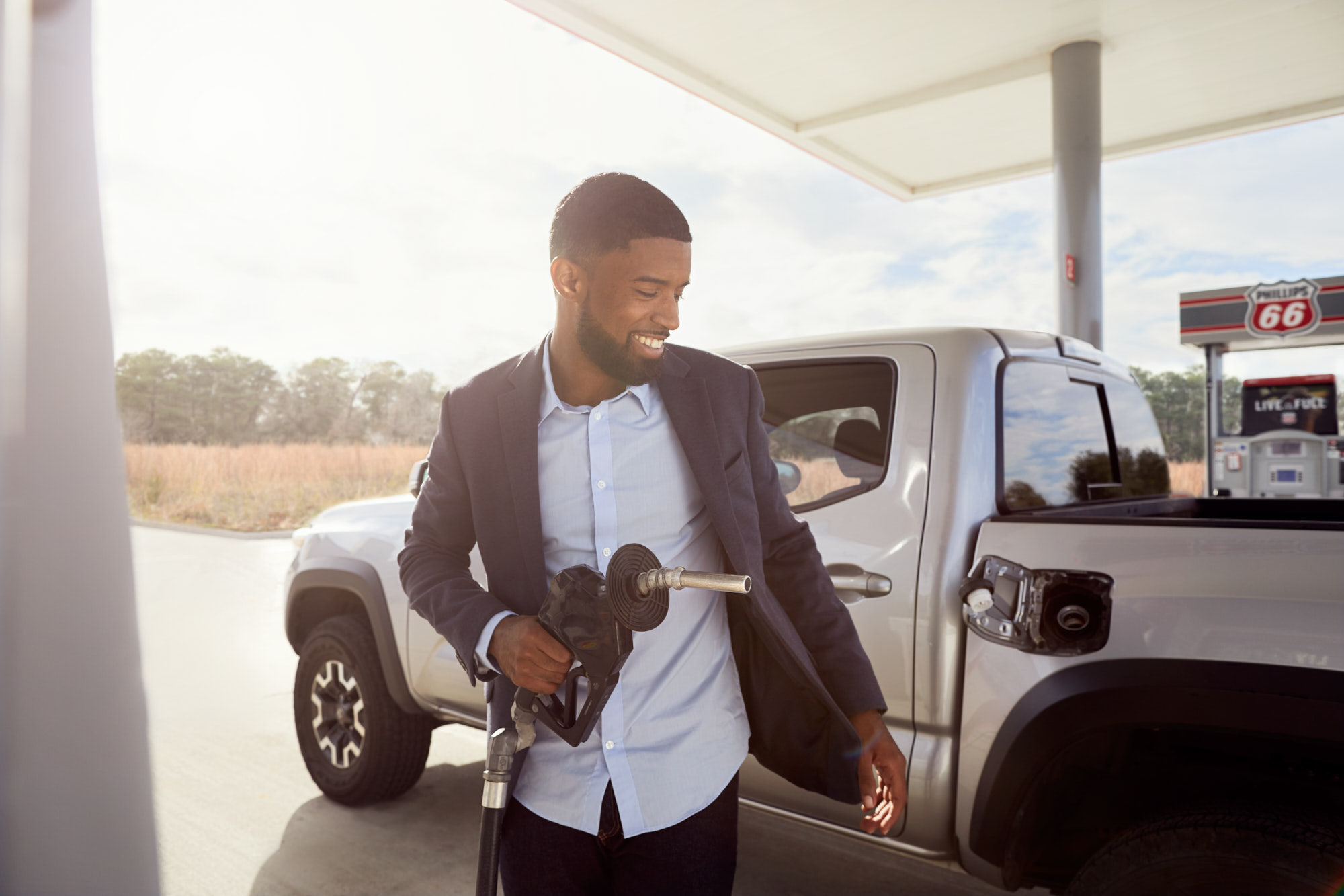 Smiling Man Pumps Gas | Brand Lifestyle Photography